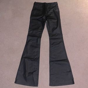 Black pleather flare tall pants in size medium.